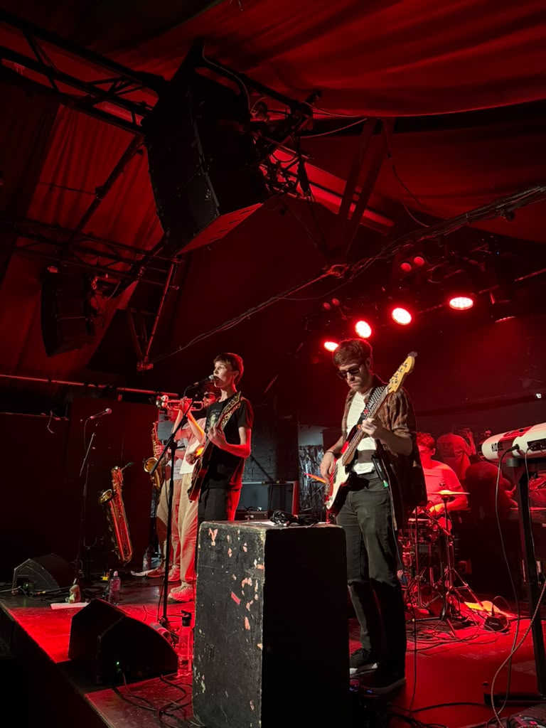 Michael and Sam under red stage lights